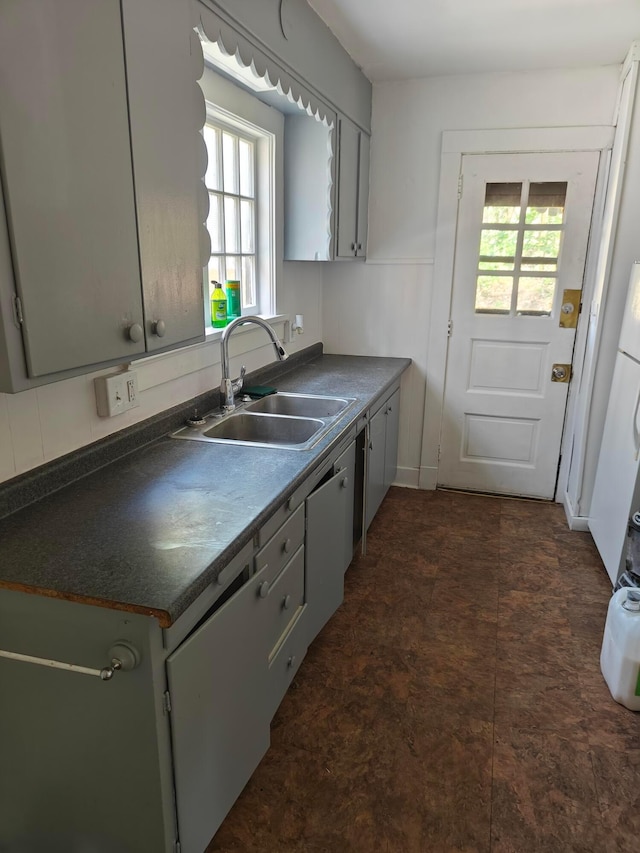 16 N 7th St, Newark, OH 43055 - kitchen with a sink, dark countertops, and healthy amount of natural light