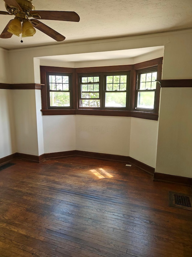 16 N 7th St, Newark, OH 43055 - unfurnished room featuring dark wood-style flooring, ceiling fan, and baseboards