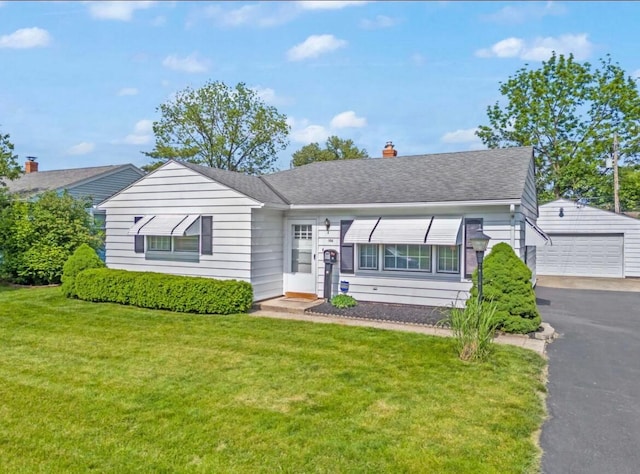164 Sturbridge Rd, Columbus, OH 43228 - view of front of property featuring a detached garage, a front yard, an outbuilding, a chimney, and roof with shingles