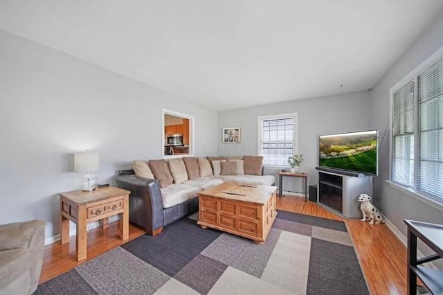 164 Sturbridge Rd, Columbus, OH 43228 - living area with dark wood-style flooring and baseboards