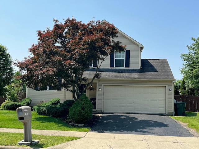 7221 Dewfall Dr, Reynoldsburg, OH 43068 - view of front of property featuring asphalt driveway, a garage, and a shingled roof