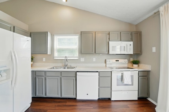 7221 Dewfall Dr, Reynoldsburg, OH 43068 - kitchen with white appliances, gray cabinets, a sink, lofted ceiling, and dark wood-type flooring