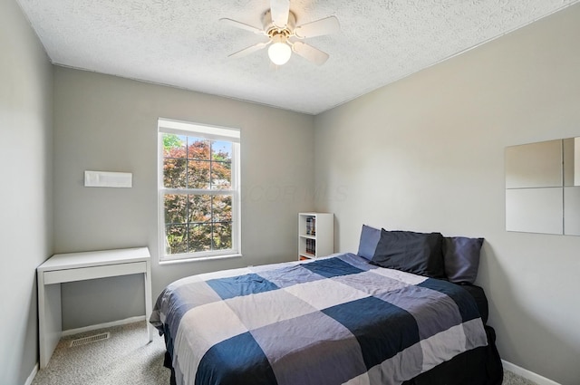 7221 Dewfall Dr, Reynoldsburg, OH 43068 - bedroom with carpet flooring, a textured ceiling, baseboards, and a ceiling fan