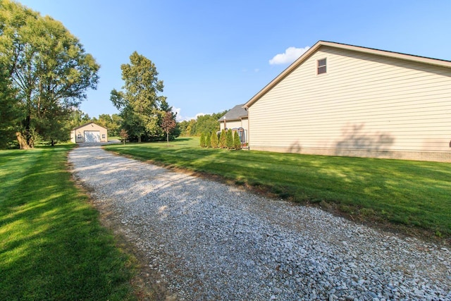 8270 Windy Hollow Rd, Johnstown, OH 43031 - view of home's exterior with a yard, a detached garage, and an outbuilding