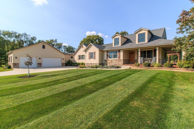 8270 Windy Hollow Rd, Johnstown, OH 43031 - view of front facade with stone siding, covered porch, a garage, and a front yard