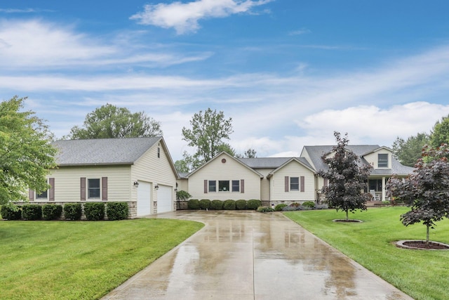 8270 Windy Hollow Rd, Johnstown, OH 43031 - view of front facade with concrete driveway, a front lawn, an outdoor structure, and an attached garage
