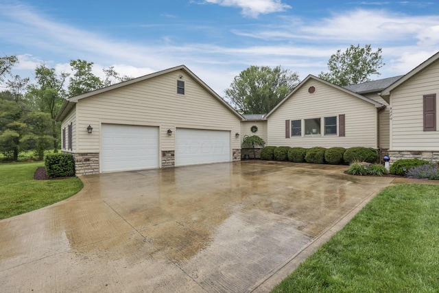 8270 Windy Hollow Rd, Johnstown, OH 43031 - ranch-style home featuring concrete driveway, stone siding, a garage, and a front lawn
