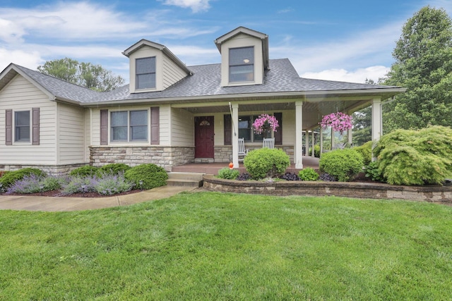 8270 Windy Hollow Rd, Johnstown, OH 43031 - view of front of home with a front lawn, stone siding, a shingled roof, and covered porch