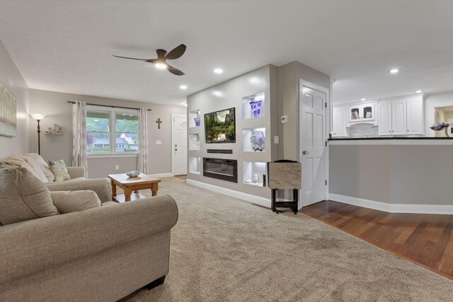 8270 Windy Hollow Rd, Johnstown, OH 43031 - carpeted living room with ceiling fan, a glass covered fireplace, recessed lighting, and baseboards
