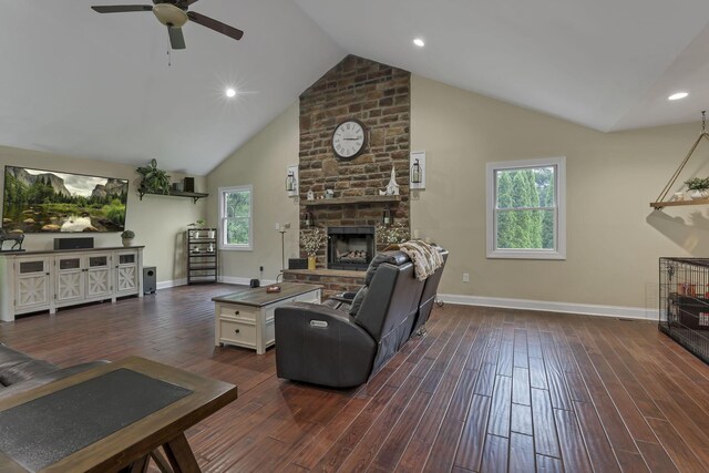 8270 Windy Hollow Rd, Johnstown, OH 43031 - living room featuring a fireplace, ceiling fan, baseboards, dark wood-style flooring, and high vaulted ceiling