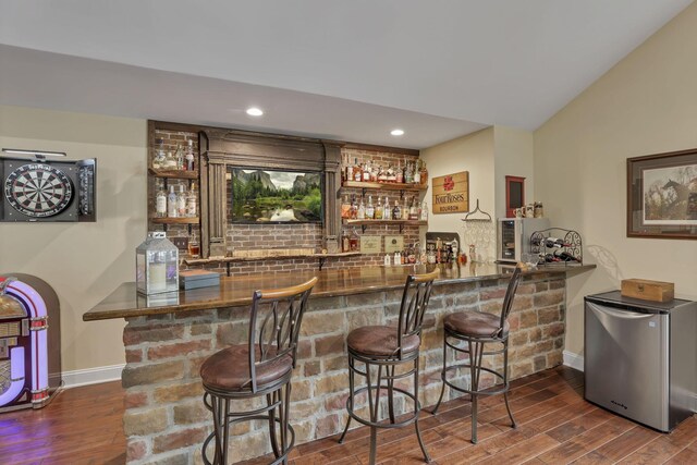 8270 Windy Hollow Rd, Johnstown, OH 43031 - indoor wet bar with refrigerator, wood finished floors, baseboards, recessed lighting, and lofted ceiling