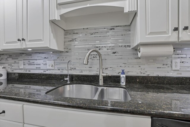 8270 Windy Hollow Rd, Johnstown, OH 43031 - kitchen with a sink, white cabinets, tasteful backsplash, and dark stone counters