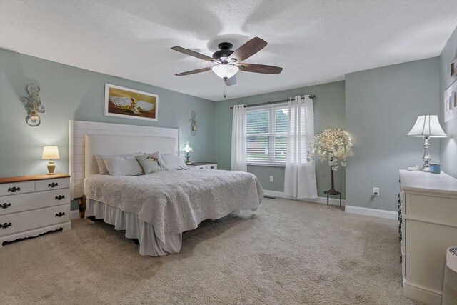 8270 Windy Hollow Rd, Johnstown, OH 43031 - carpeted bedroom with baseboards, a ceiling fan, and a textured ceiling