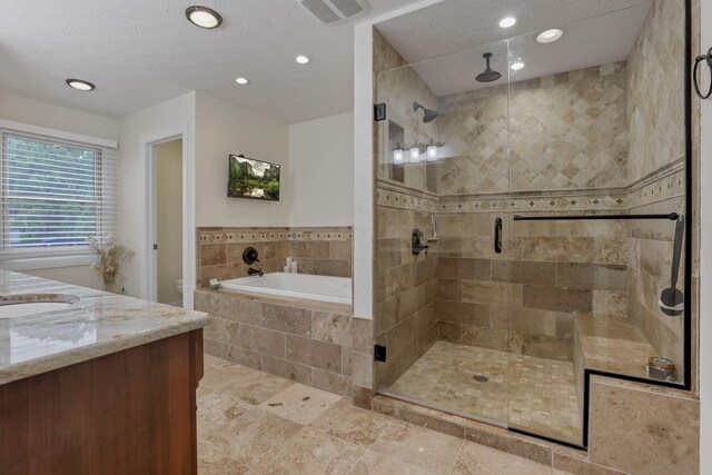 8270 Windy Hollow Rd, Johnstown, OH 43031 - bathroom featuring a bath, a stall shower, vanity, recessed lighting, and toilet