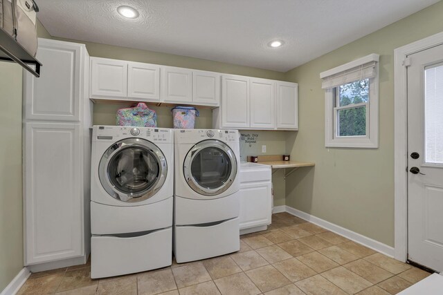 8270 Windy Hollow Rd, Johnstown, OH 43031 - laundry room with cabinet space, separate washer and dryer, baseboards, recessed lighting, and a textured ceiling