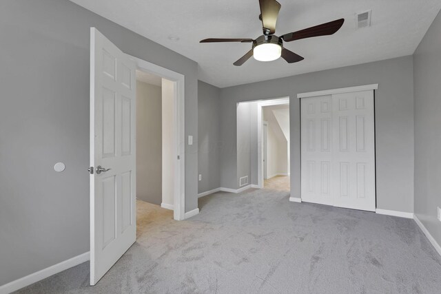8270 Windy Hollow Rd, Johnstown, OH 43031 - unfurnished bedroom featuring carpet, baseboards, a closet, and ceiling fan