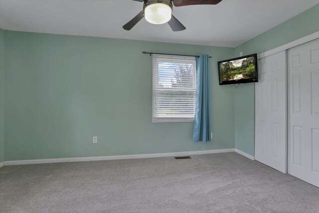 8270 Windy Hollow Rd, Johnstown, OH 43031 - unfurnished bedroom featuring carpet, baseboards, a closet, and a ceiling fan