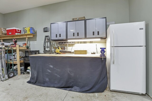 8270 Windy Hollow Rd, Johnstown, OH 43031 - kitchen with freestanding refrigerator and concrete flooring
