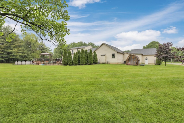 8270 Windy Hollow Rd, Johnstown, OH 43031 - view of green lawn featuring a gazebo and an exterior structure