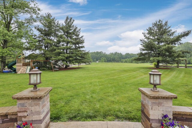 8270 Windy Hollow Rd, Johnstown, OH 43031 - view of green lawn with a playground
