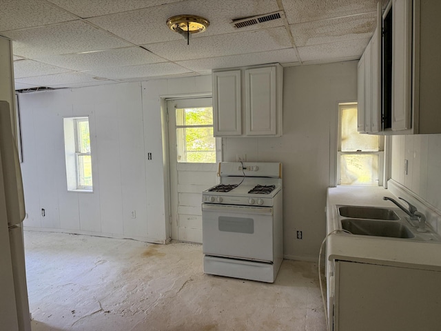 140 Sycamore St, Glouster, OH 45732 - kitchen featuring white appliances, a sink, a paneled ceiling, and light countertops