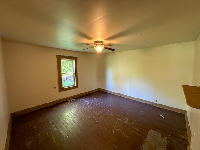 140 Sycamore St, Glouster, OH 45732 - spare room featuring a ceiling fan, dark wood-style floors, and baseboards