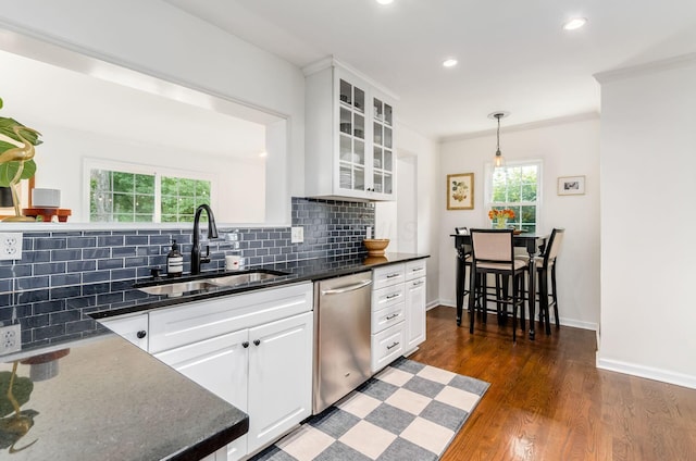 232 N Stanwood Rd, Columbus, OH 43209 - kitchen with a sink, stainless steel dishwasher, tasteful backsplash, crown molding, and dark wood finished floors