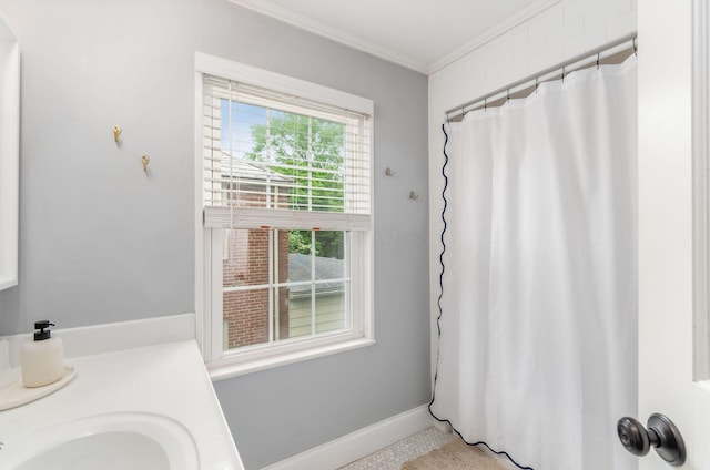 232 N Stanwood Rd, Columbus, OH 43209 - bathroom featuring ornamental molding, a sink, baseboards, and a shower with shower curtain