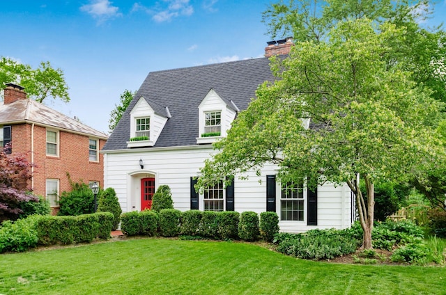 232 N Stanwood Rd, Columbus, OH 43209 - cape cod home featuring a front lawn and a chimney