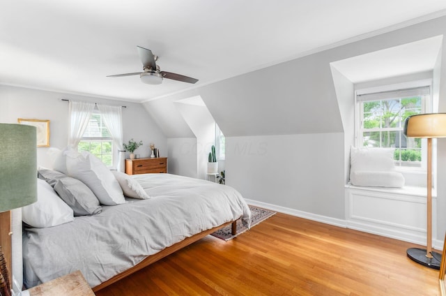 232 N Stanwood Rd, Columbus, OH 43209 - bedroom featuring wood finished floors, ceiling fan, vaulted ceiling, baseboards, and crown molding