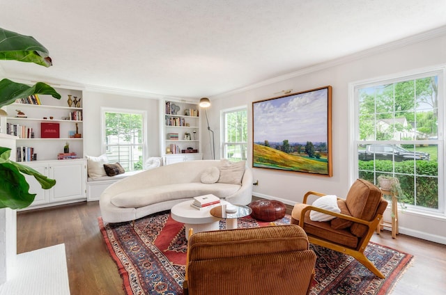 232 N Stanwood Rd, Columbus, OH 43209 - living area featuring ornamental molding, wood finished floors, baseboards, and built in shelves
