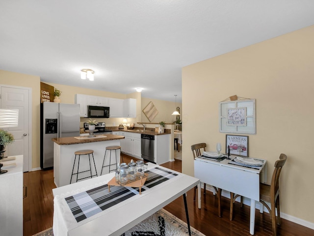 6010 Turnwood Dr Unit 703, Westerville, OH 43081 - dining room featuring dark wood-style flooring and baseboards