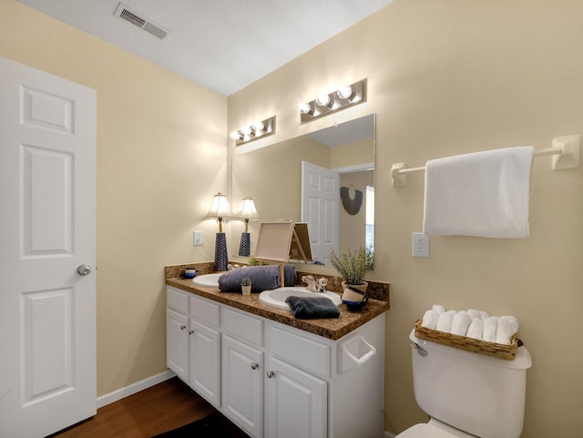 6010 Turnwood Dr Unit 703, Westerville, OH 43081 - bathroom with vanity, toilet, wood finished floors, and baseboards