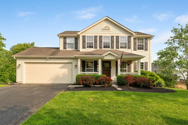 369 Highbanks Valley Ct, Newark, OH 43055 - view of front facade featuring asphalt driveway, a porch, an attached garage, and a front lawn