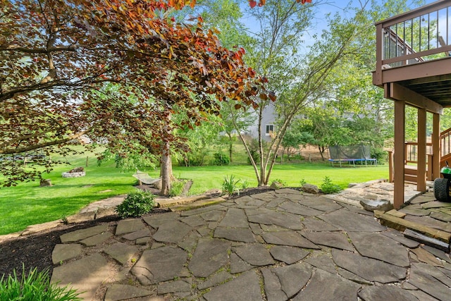 369 Highbanks Valley Ct, Newark, OH 43055 - view of patio / terrace with a trampoline and a wooden deck