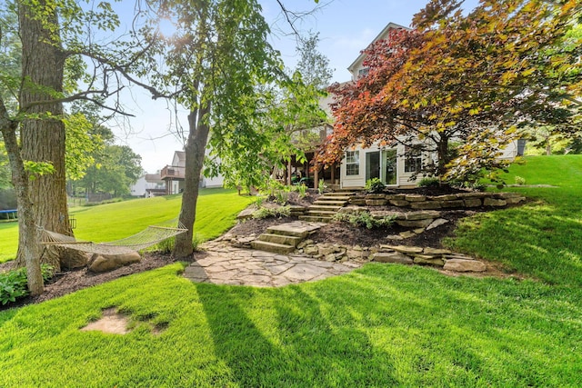 369 Highbanks Valley Ct, Newark, OH 43055 - view of green lawn with a trampoline