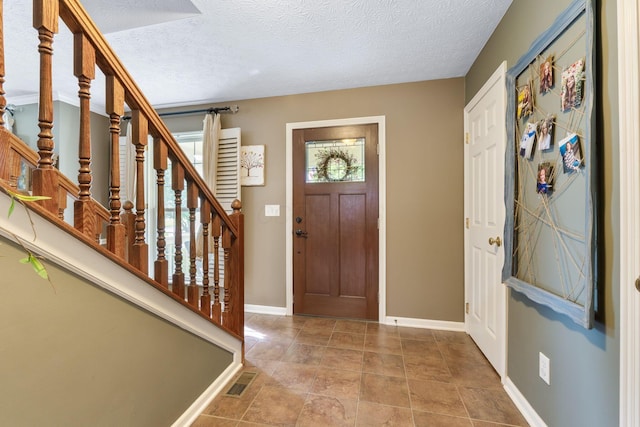 369 Highbanks Valley Ct, Newark, OH 43055 - foyer with stairway and a textured ceiling