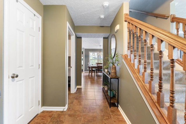 369 Highbanks Valley Ct, Newark, OH 43055 - corridor featuring a textured ceiling and stairs