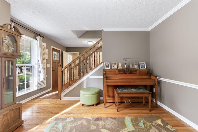 369 Highbanks Valley Ct, Newark, OH 43055 - stairway with wood finished floors, a textured ceiling, and crown molding