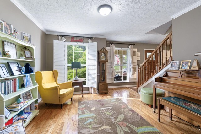 369 Highbanks Valley Ct, Newark, OH 43055 - living area featuring ornamental molding, a textured ceiling, wood finished floors, and stairway