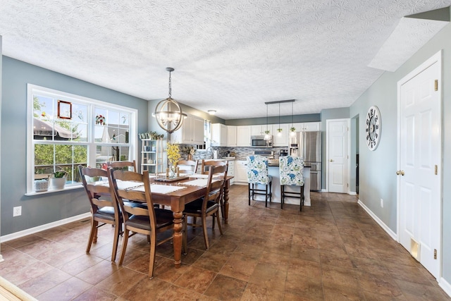 369 Highbanks Valley Ct, Newark, OH 43055 - dining room featuring a chandelier and a textured ceiling