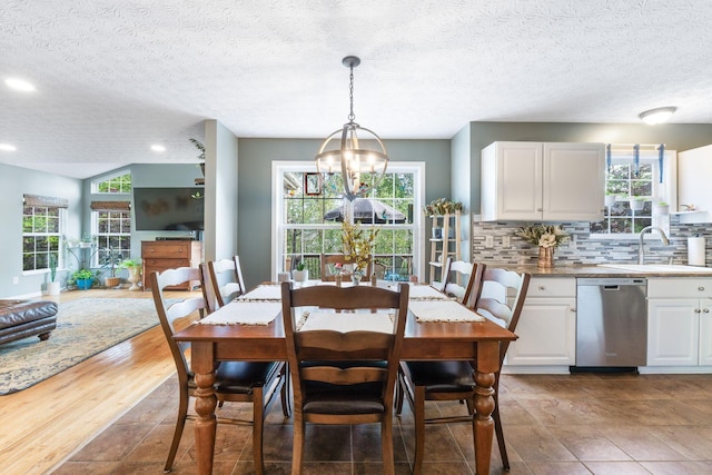 369 Highbanks Valley Ct, Newark, OH 43055 - dining space with a textured ceiling, a chandelier, healthy amount of natural light, and recessed lighting