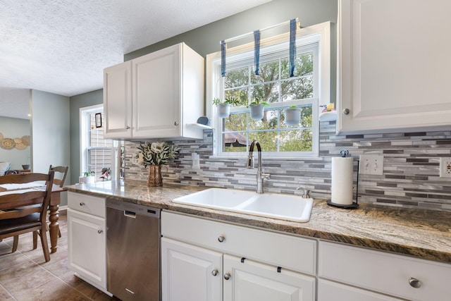 369 Highbanks Valley Ct, Newark, OH 43055 - kitchen with dishwasher, decorative backsplash, white cabinets, a textured ceiling, and tile patterned floors
