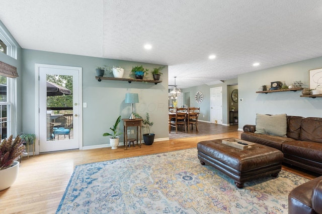 369 Highbanks Valley Ct, Newark, OH 43055 - living area with wood finished floors, recessed lighting, and a textured ceiling