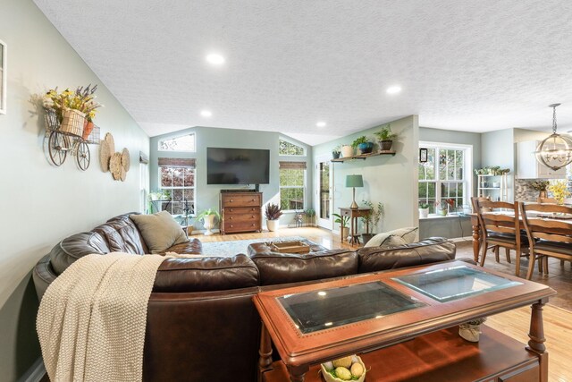 369 Highbanks Valley Ct, Newark, OH 43055 - living room featuring wood finished floors, a textured ceiling, plenty of natural light, recessed lighting, and a chandelier