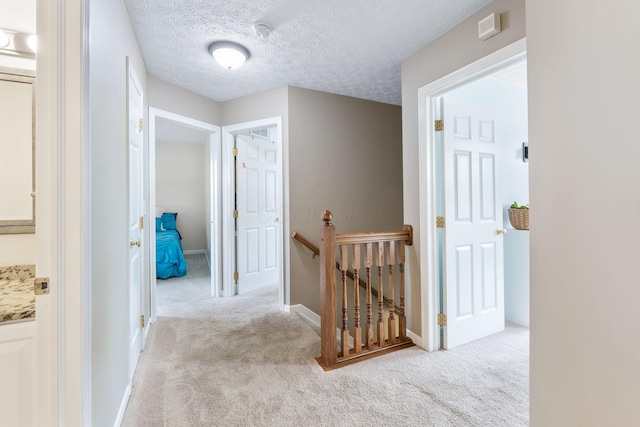 369 Highbanks Valley Ct, Newark, OH 43055 - corridor with an upstairs landing, carpet flooring, and a textured ceiling