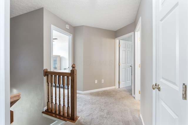 369 Highbanks Valley Ct, Newark, OH 43055 - hall with carpet, a textured ceiling, and an upstairs landing