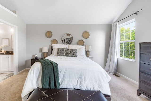 369 Highbanks Valley Ct, Newark, OH 43055 - bedroom with vaulted ceiling, light carpet, ensuite bathroom, and a textured ceiling