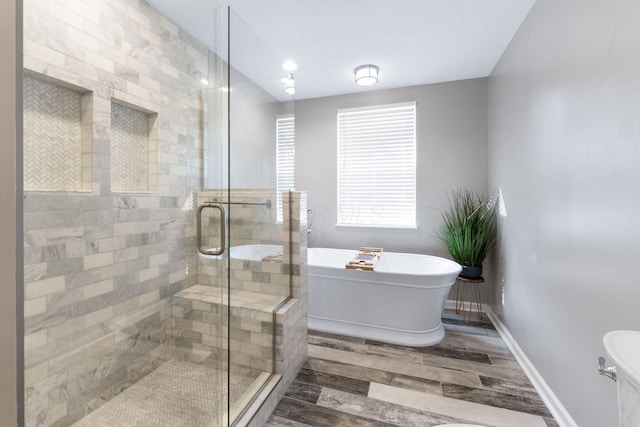 369 Highbanks Valley Ct, Newark, OH 43055 - bathroom with a freestanding tub, wood finished floors, and a shower stall