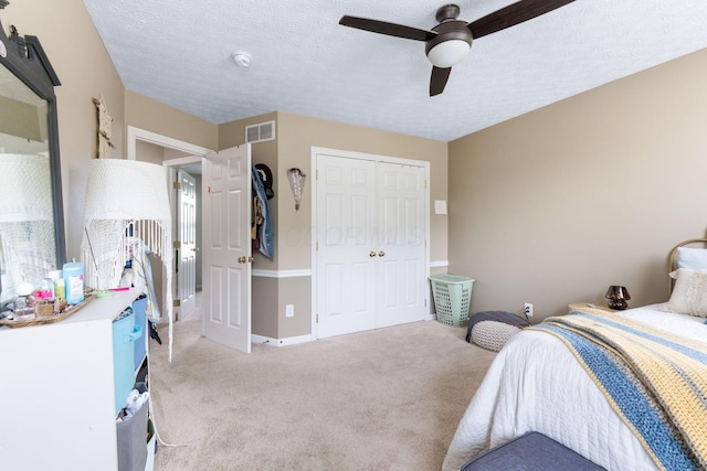 369 Highbanks Valley Ct, Newark, OH 43055 - bedroom with light colored carpet, a closet, a ceiling fan, and a textured ceiling